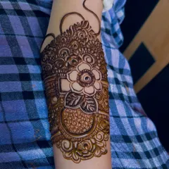 A detailed arm band for bride Rumana, featuring a large central flower.