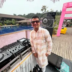 Dressed in traditional wear for a poolside Mehendi party. I'm here to keep the party alive and the love flowing with a custom playlist.