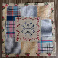 This envelope pouch is a template for a future product line, made entirely from leftover fabric scraps. Of course, I had to add a small, hand-embroidered motif to the center.