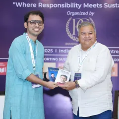 Exchanging ideas and books with fellow speakers. The journey towards a sustainable future is a collective one, built on shared knowledge and mutual respect.