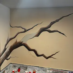 Here you can see the foundation of the mural taking shape. I first sketch and then paint the main branches of the tree, creating the structure that will soon be filled with leaves and life.