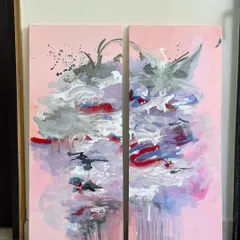 This is a diptych, a set of two paintings designed to be displayed together. The abstract design flows across both canvases, creating a larger, more impactful piece with beautiful drips and splashes of color.