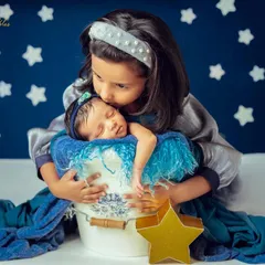 There is nothing more precious than the bond between siblings. I always make time in my sessions to capture these first gentle cuddles, creating a beautiful record of your growing family's love story.