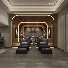 An elegant home theater with a dramatic arched entryway feature, plush leather recliners, and a dedicated bar area. The wood paneling and warm lighting create a sophisticated and inviting ambiance.