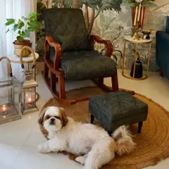 Tofu relaxing on the jute rug. He loves finding cool spots to lie down, and this corner with the rocking chair is one of his favorites.
