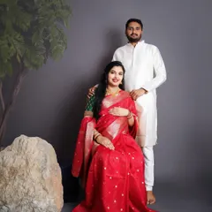 Celebrating our beautiful traditions with a classic Seemantham-style maternity portrait. The rich red saree and traditional attire for the couple make for a truly timeless and elegant memory.