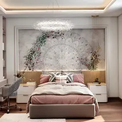 An elegant and artistic bedroom design featuring a large, beautiful mandala mural as a focal point. The combination of soft pinks, a stunning crystal chandelier, and a sleek desk creates a sophisticated space for a teen.