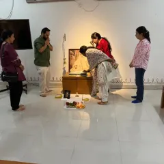 Members of our Sangha taking turns to make offerings at the Sadhguru Sannidhi. It is a collective process where each person contributes to the devotional atmosphere of the space.