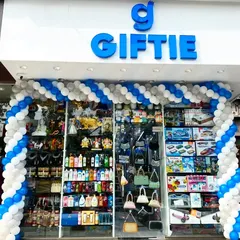 A blue and white balloon arch for the second shop opening of "Giftie," matching the brand's logo color.