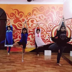 Students of different ages practicing Vrikshasana (Tree Pose) together in our Noida studio. This asana is excellent for improving balance and grounding your energy.