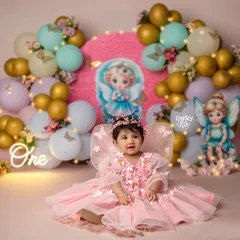 Every little girl is an angel. For this first birthday shoot, we created a heavenly fairy theme with soft pinks, delicate wings, and a touch of sparkle to celebrate her turning one.