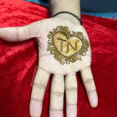 Mehendi for the groom! A simple yet meaningful design featuring the couple's initials inside a heart, a lovely way for the groom to honor his bride.