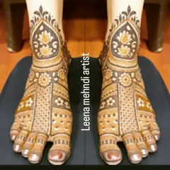 A full-coverage bridal foot design with a beautiful dark stain. The pattern features traditional motifs and fills the entire foot for a classic bridal look.