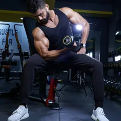 There is no secret. It's about focused, intense effort on every single rep. Here, I'm concentrating on a bicep curl, ensuring perfect form to maximize muscle growth.