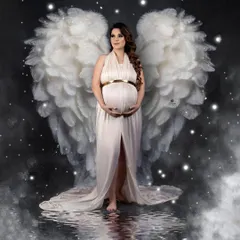 Another take on the angel wings theme, this portrait has a magical, ethereal feel. The white gown, starry night effect, and water reflection combine to create a beautiful fantasy image.