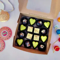 A closer look at my Indian fusion chocolate box. It features heart-shaped Paan Delight chocolates, square Rasmalai Pistachio pieces, and dark chocolate Almond Crackle bites.