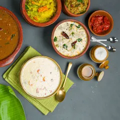 We serve a wide variety of authentic regional Indian meals, from Chettinad to Kerala specials. This spread showcases some of our popular curries and payasam, all served in traditional earthenware to keep the flavors intact.