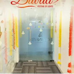 Bringing the festival of lights to the office. We decorated this entrance with traditional marigold garlands and diya decals on the glass door to welcome everyone with the warmth of Diwali.