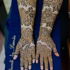 The full view of the floral 'baat pakki' design, showing how the patterns create a cohesive and beautiful look across both arms.