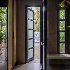 We designed this bathroom to open up to a private garden, creating a spa-like experience. The walk-in shower with a built-in bench and large windows allows you to feel connected to nature while you unwind.