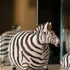 Dare to go bold with this quirky zebra figurine from my Wild Noir Collection. Inspired by nature’s raw edge, this piece is crafted to bring a dramatic yet elegant statement to your space.