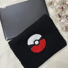 A top-down view of the custom crochet laptop sleeve, perfect for any Pokémon trainer. All my sleeves are made to order to fit your device perfectly.