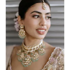 A close-up of the 'Desi Clean Girl' aesthetic. Notice the dewy, reflective skin, the soft and natural-looking brows, and the subtle definition on the eyes. It's all about enhancing, not covering.