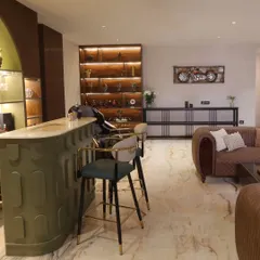 A close-up of the sleek, PU-finished bar counter with a CNC design, paired with stylish bar chairs that complete the luxurious look of this entertainment space.