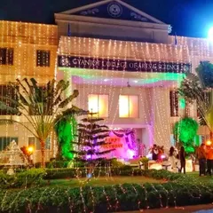 My lighting services extend to building exteriors. Here, I've decorated a college building with strings of fairy lights for an annual function, transforming the facade and creating a festive look for the event.