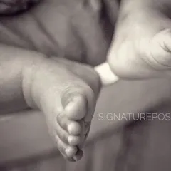 Ten tiny toes. This black and white close-up focuses on the perfection of a newborn's feet, a detail that changes all too quickly.