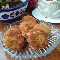 A plate of my crispy and creamy Malai Kebabs. These chicken cutlets are tender on the inside with a golden breadcrumb coating, making them an irresistible savory snack.