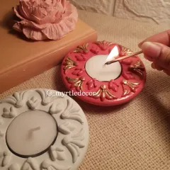 The simple act of lighting a diya can bring so much warmth. Here is one of our ornate Jesmonite T-light holders, hand-painted with gold accents to catch the light beautifully. It’s a small piece designed to make a big impact during the festive season.