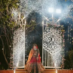 A bride's grand entrance is a moment of pure theatre. We capture her descending the steps, framed by sparkling cold pyros, as she makes her way toward her future.