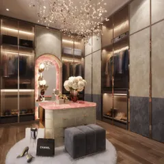 This is a dream dressing room brought to life, featuring a stunning pink onyx vanity island and custom glass wardrobes. It’s one of those little indulgences that transforms a daily routine into a luxurious experience, reflecting the client's unique style and personality.