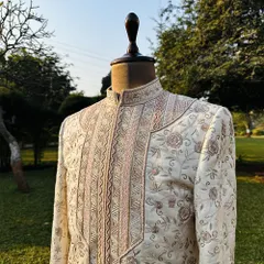This is our Koyaliya Sherwani, a masterpiece crafted from luxurious, cruelty-free Ahimsa silk. Over 120 hours of intricate hand embroidery go into each piece, telling a story of artistry and timeless elegance.