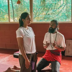 A student writes Sanskrit terms on the blackboard. Learning the language of yoga is a way of honoring its roots and understanding the deeper meaning behind the words we use in class.