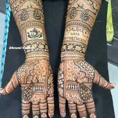 I absolutely love creating fun and quirky designs. This bride's love story was captured with the unique hashtag "Dalrice weds Butterchicken," making her mehendi truly one of a kind.