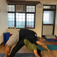 Here I am acting as the base for a student in a supported backbend. This partner stretch helps to safely open the chest and spine far more than one could alone.
