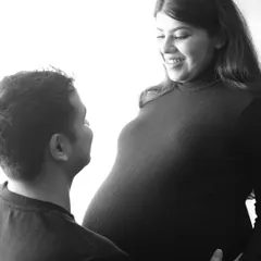 The look of love. This black and white close-up captures the happy, intimate gaze between a husband and his expecting wife. So pure and beautiful.