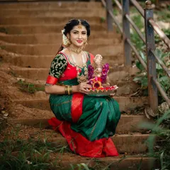 A beautiful portrait with Lord Ganesha. The rich colors of the saree and the traditional jewelry are perfect for celebrating our heritage.