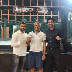 Success is a team effort. Here, our instructors and black belts display the medals earned at an MMA event. We consistently participate in competitions to refine our skills, ensuring that our teaching methods are always evolving and grounded in real-world fighting experience.