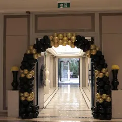 A classic and sophisticated entrance arch in a black and gold theme. This balloon arch is perfect for milestone birthdays, anniversaries, or corporate events, creating a chic and stylish entryway.