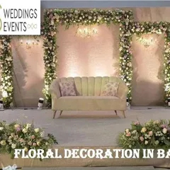 This promotional image highlights our expertise in floral decoration in Bangalore, showing a lavish stage fully adorned with white and pastel flowers, demonstrating our ability to create grand and immersive environments.