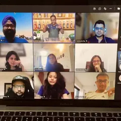 The virtual bar is open. A full screen of enthusiastic participants on a video call, ready to learn, shake, and sip.