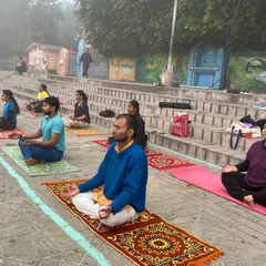 Students meditating on the steps of the ghat in Haridwar, absorbing the spiritual energy of the place.
