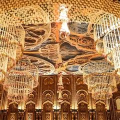 My obsession with flowers is real, and I believe in using them in powerful, unexpected ways. Here, we designed massive chandeliers woven entirely from fresh mogra for a South Indian wedding, creating a fragrant canopy over the intricately carved mandap.
