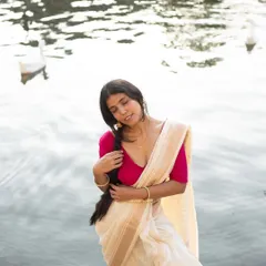 A serene, expressive portrait in a silk saree, highlighting the soft fabric and my ability to convey a gentle, feminine mood for ethnic wear brands.