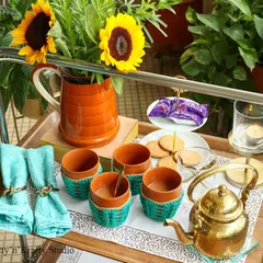 A beautiful tea service set up on a trolley, featuring my handmade crochet cozies for the kulhad clay cups. It’s the little details that make tea time feel special.