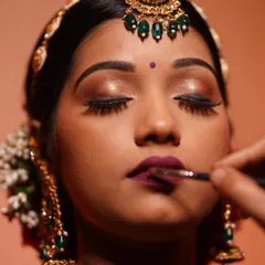 The art is in the details. A steady hand and the right brush are key to creating the perfect bold lip. We guide our students through every step to achieve crisp, defined, and long-lasting lip color.