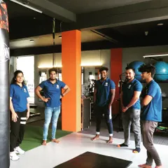 Our team of trainers discussing programming and client progress. We work collaboratively to provide the best service.